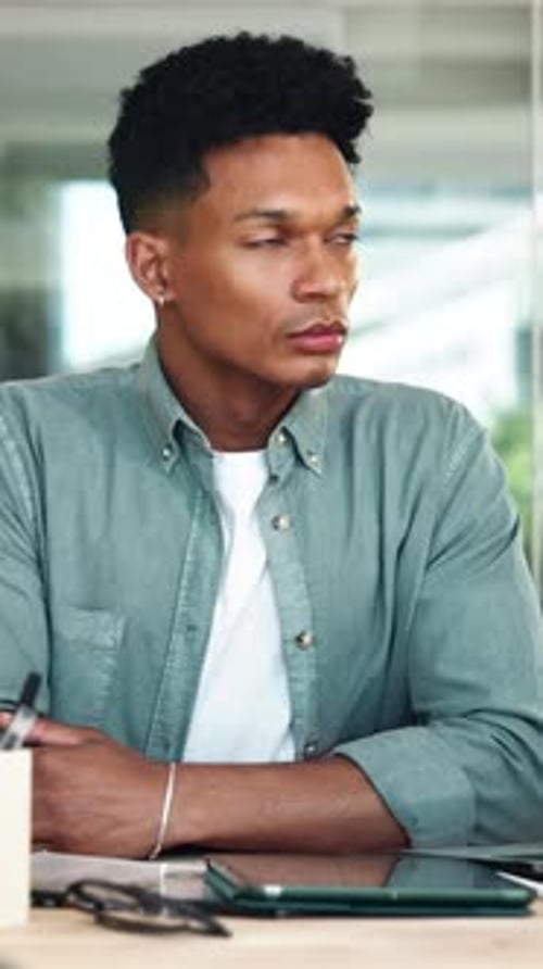 Thinking, tablet and creative man in startup for inspiration, research project or perspective