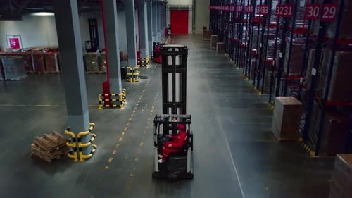Warehouse Forklift Moving Along Storage Racks