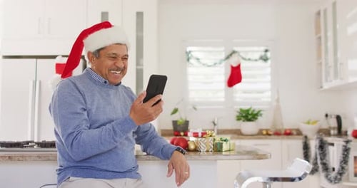 Man in Santa Hat Video Calling on Christmas Day