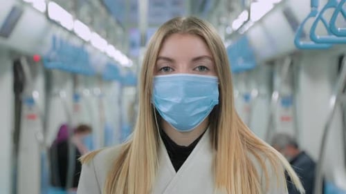 Woman in Protective Mask During in Metro While Pandemic