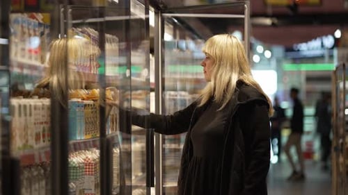 Rivne Ukraine November 14 2022 Buy Dairy Products in a Supermarket