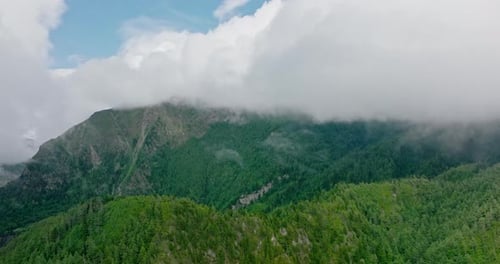 Fog Enveloping The Lush Mountain Valleys Of Nepal During The Day