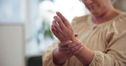 Senior Woman Massaging Her Aching Wrist