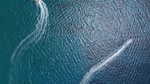 Motor Boats And White Wakes In The Ocean - Aerial Top Down