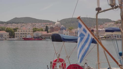 Perspective shot of Mytilene harbour view with city historical buildings, church, boats in view