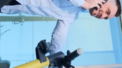 Young Office Manager Talking on the Phone Using an Electric Scooter Vertical Video