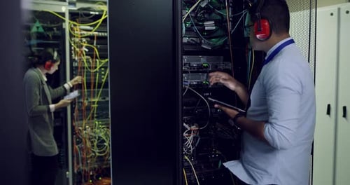 IT Team Working in a Modern Server Room