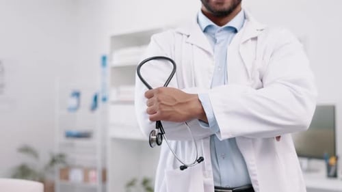 Healthcare, arms crossed and hands of a doctor with a stethoscope for consulting and hospital care