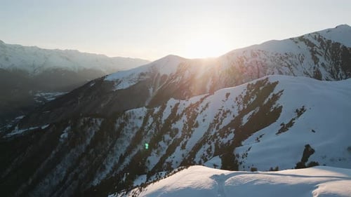 Winter Mountain Range at Sunset Aerial View