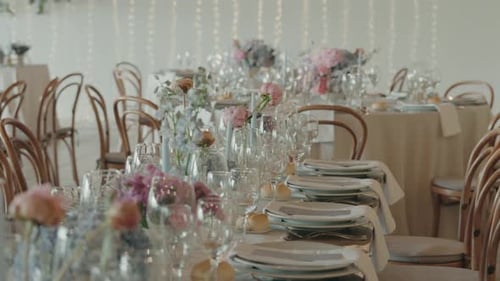 Wedding Reception Table Setting with Flowers and Glassware
