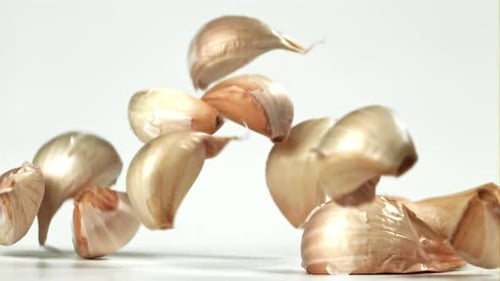 Fresh Garlic Falls on the Table Filmed on a Highspeed Camera at 1000 Fps