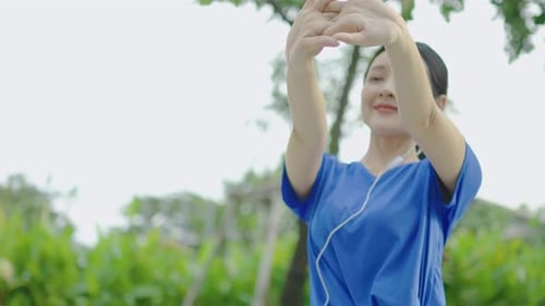 Athletic Woman Stretching Before Workout in Park