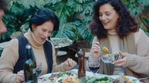 Friends and Family Enjoying Meal Together Outside
