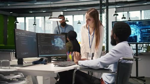 Young Engineer and Coworker with Paraplegia Using AI Doing Brainstorming