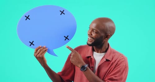 Man Holding and Pointing to Blue Speech Bubble