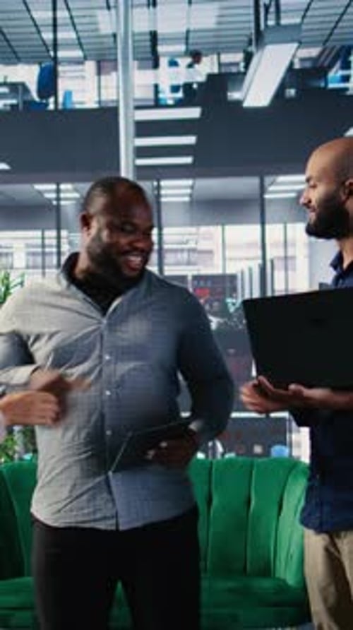 Vertical Video Business People Sharing a Handshake to Mark Commitment to the Partnership