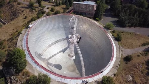 Low Rotating Aerial Shot of Mount Aragats Radio Optical Telescope's Herouni Mirror on a Sunny Day, A