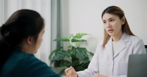 Doctor Consulting Patient in Modern Medical Office