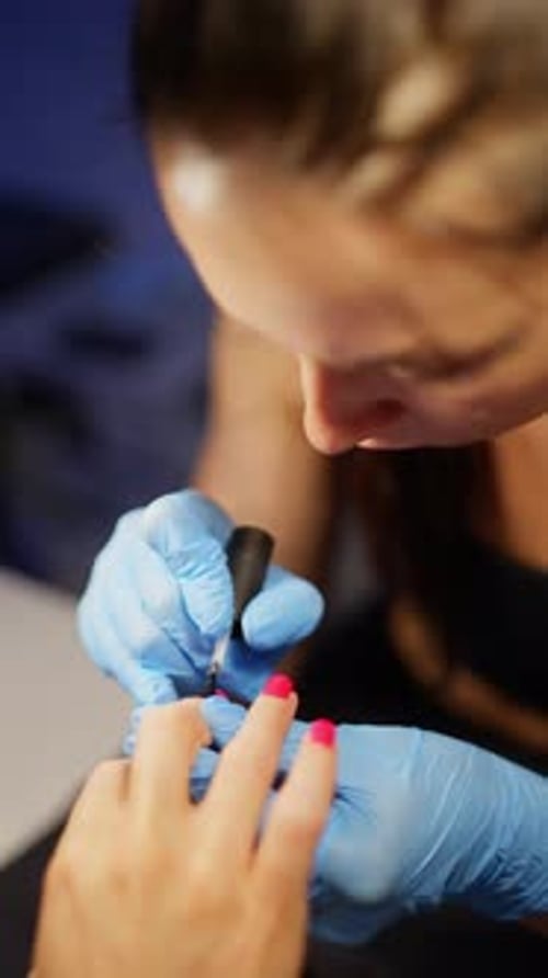 Beauty Salon Manicure Procedure with Professional Master Working on Woman Nails