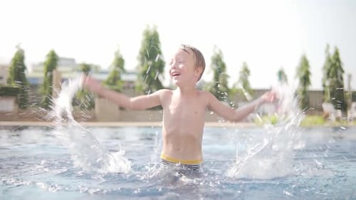 Little boy is frolicking in swimming pool