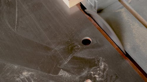 Wooden Plank Near Metal Sliding Table Saw