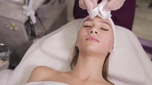 Hands of Cosmetology Specialist Cleaning Face with Cosmetic Cotton White Pad Skincare Concept