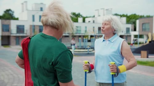 Senior Women Talking Before Walk in Neighborhood
