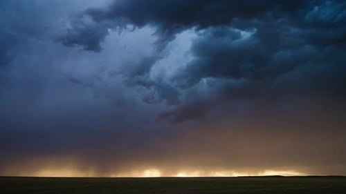 Dramatic Storm Clouds Rolling Over Field at Sunset