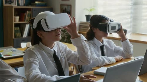Teens Wearing VR Headsets in Classroom