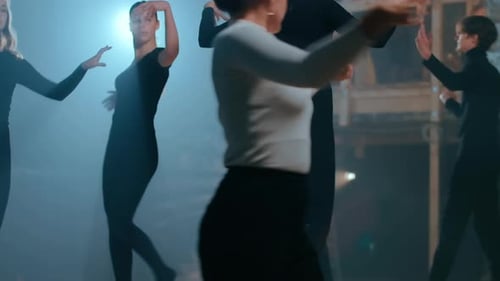 Dancers Rehearsing Choreography on Stage in Studio