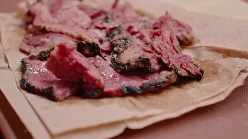 Delicious pastrami meat in preparation to make sandwich, close up