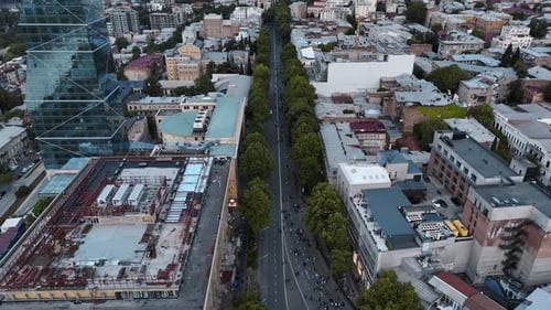 Aerial View of City Street with Crowded Gathering