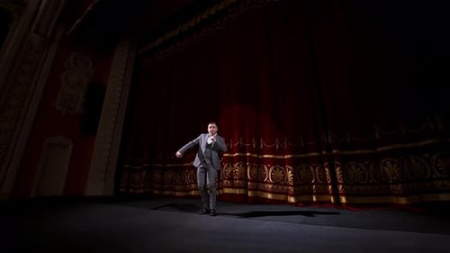 Motivational Speaker. Male actor on classic theatre stage.