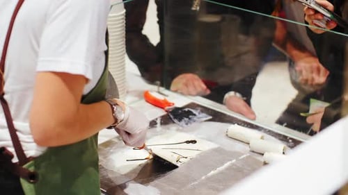 Woman Cooks Snacks in Fastfood Cafe at Shopping Mall