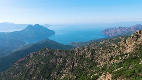 Aerial drone view of Girolata, coastal town and fort, island of Corsica, France