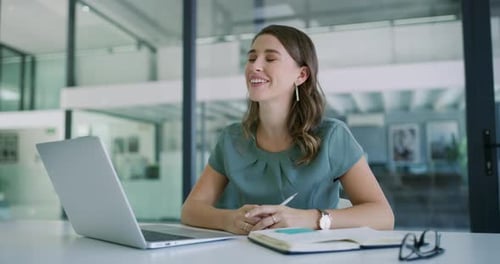 4k video footage of a young businesswoman having a video conference in a modern office
