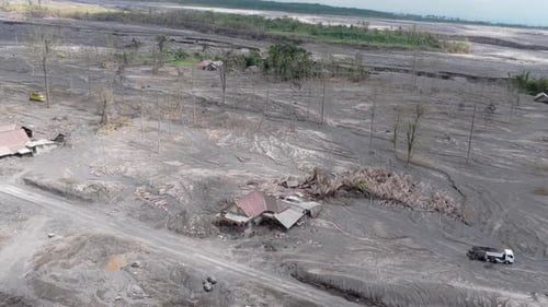 Aerial view of a village destroyed by volcanic ash and lahar mudflows from the semeru volcano