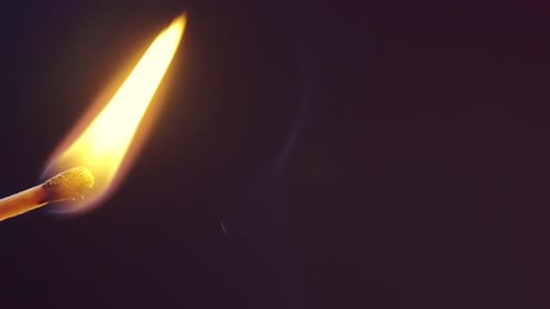 The Match Lights Up and Burns with a Yellow Flame