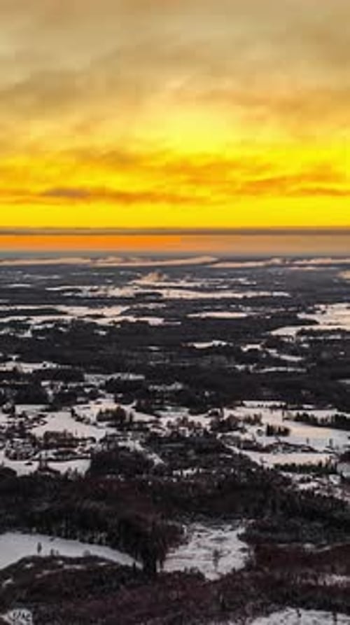 Orange Skies Over Snowy Landscape In Winter At Dusk. - vertical, timelapse shot