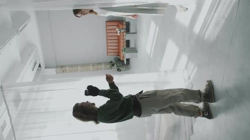 Photographer Directing Model during Photo Shoot in Minimalist Studio