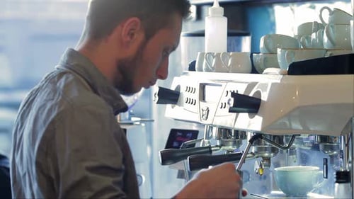 Barista at Work in a Cafe