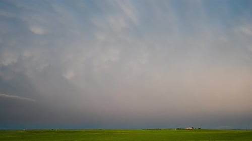 Dramatic Lightning Strikes Over a Rural Grassy Field
