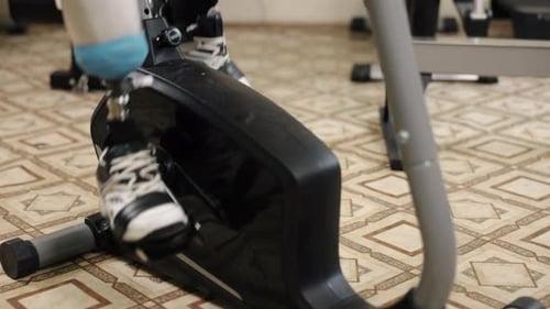 Man with Prosthetic Leg Using Exercise Bike