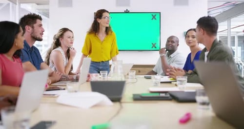 Diverse Team Having Meeting with Green Screen Presentation