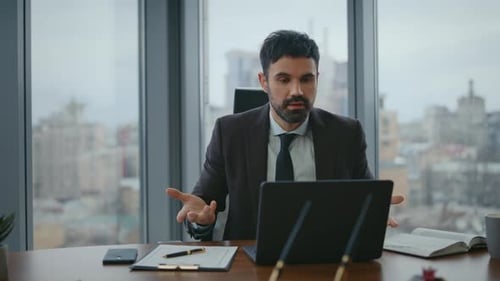 Businessman Explaining During Video Conference in Modern Office