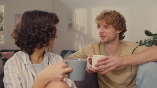 Couple with Cups of Hot Coffee