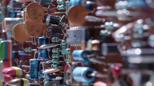 Intricate design of circuit board with electrical components, closeup slider