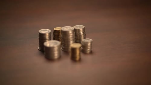 Stacks of Coins of Different Metals and Sizes