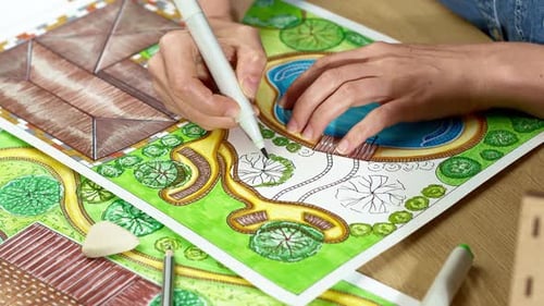 Landscape designer draws a sketch on paper. Layout.