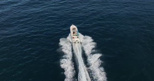 Aerial View of Floating Boat on Blue Sea at Sunny Day Fast Boat on the Sea Surface Seascape From